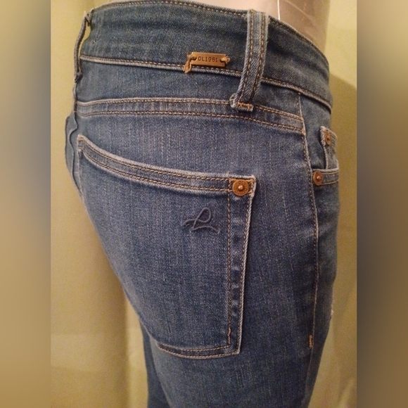 A DL1961 Ryan High-rise Blade Distressed Denim Jeans - Picture 2 of 9